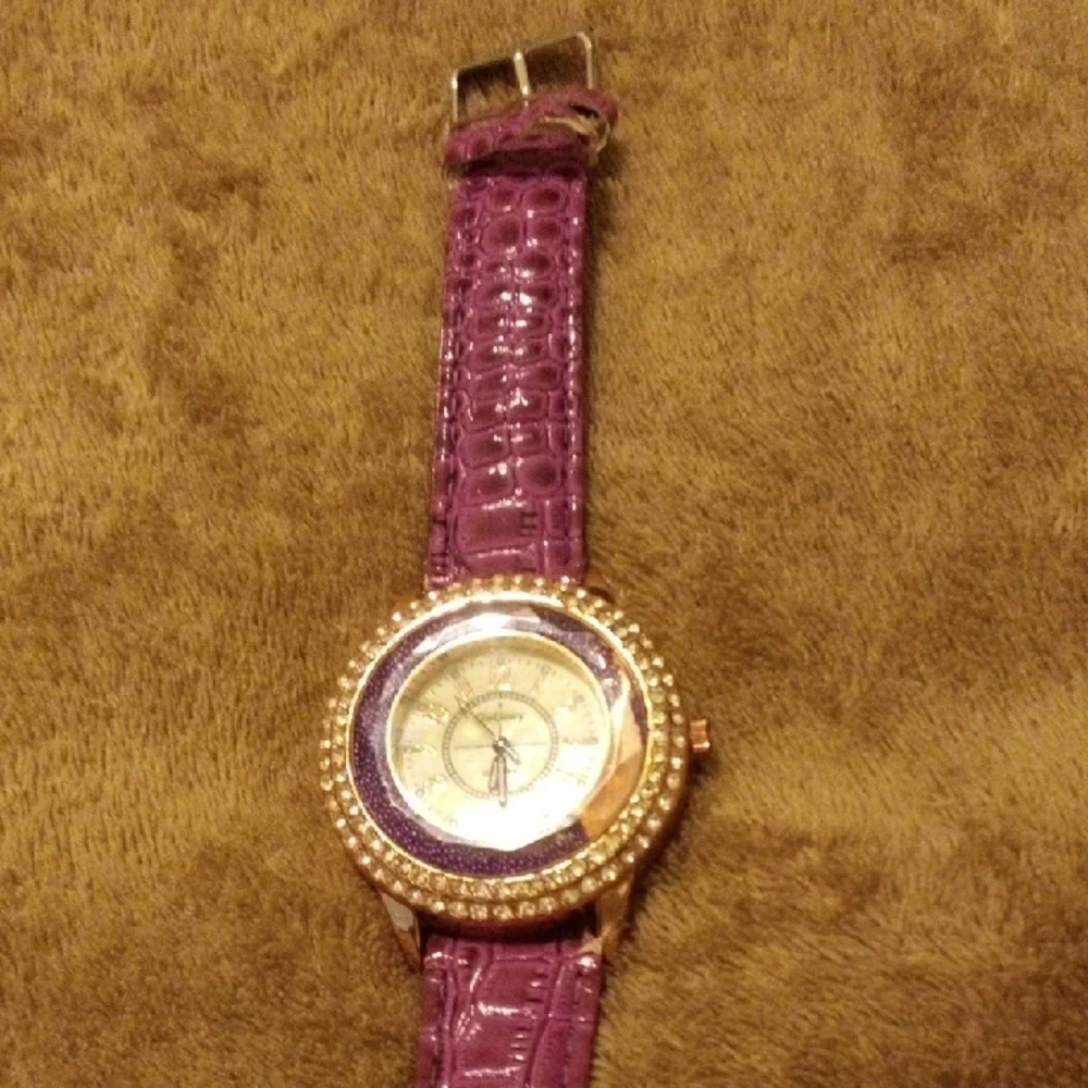 Elegant Women's Watch with Purple Strap and Gold Detailing